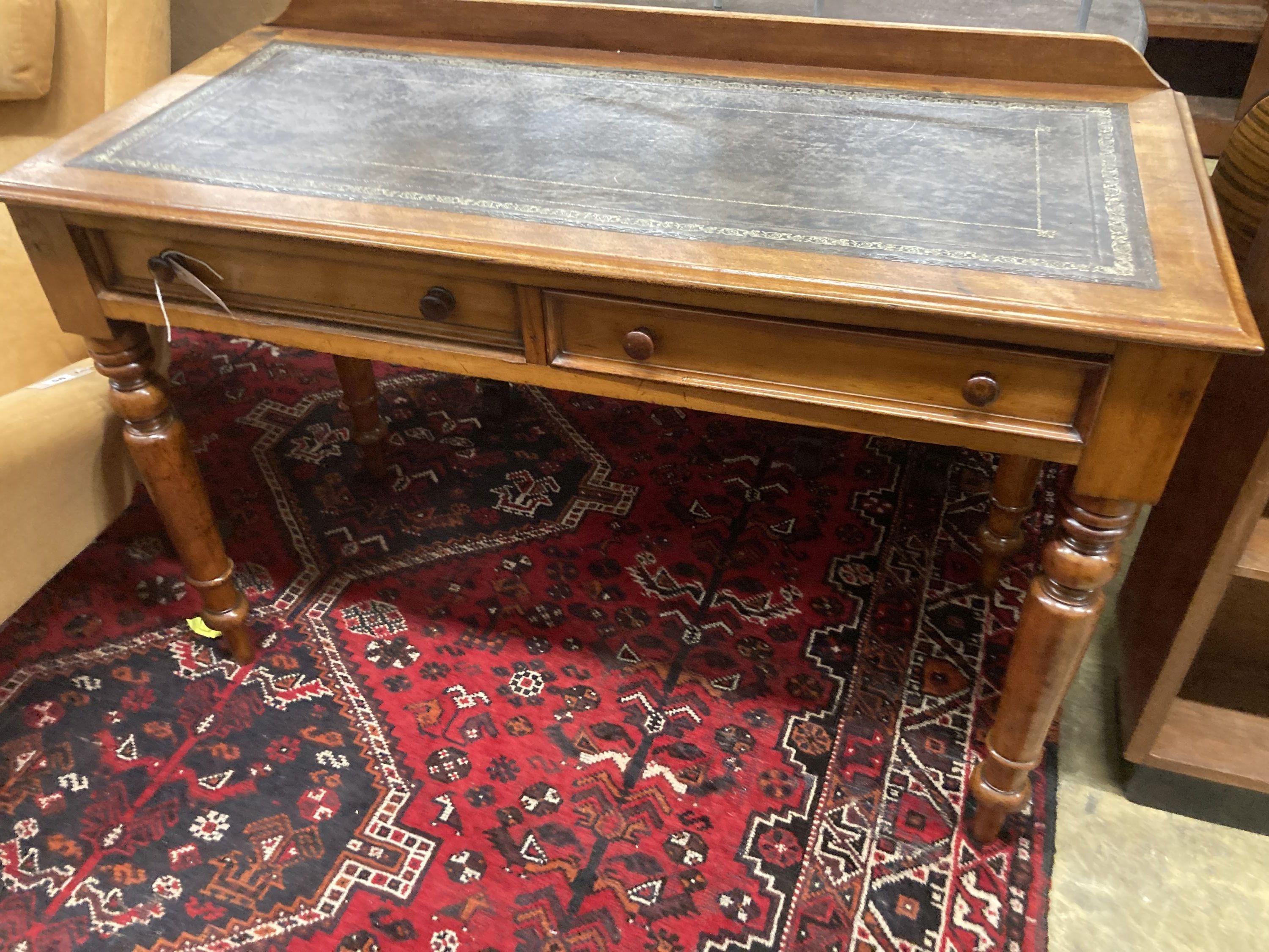 A Victorian mahogany two drawer writing table, with a leather inset top, width 114cm, depth 52cm, height 80cm